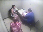 Still photographs captured from Griffin Police Department interrogation room video recording